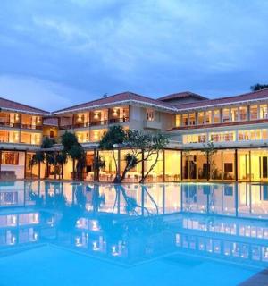 a building with a large swimming pool in front of it