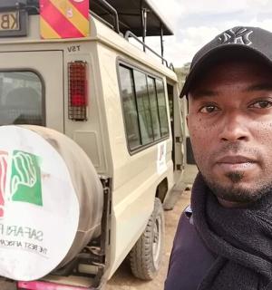 a man is standing in front of a bus