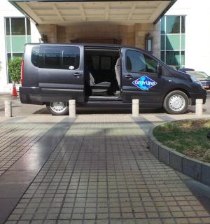 a van parked in a parking lot with its door open