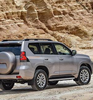 a silver truck parked on a dirt road