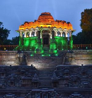a building is lit up in green at night