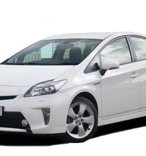 a white toyota aygo hybrid car parked