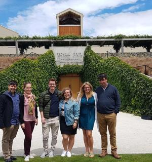 a group of people standing in front of a building