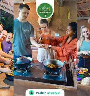a group of people standing in a kitchen preparing food