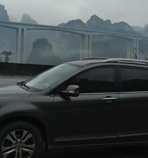 a black suv parked in a parking lot