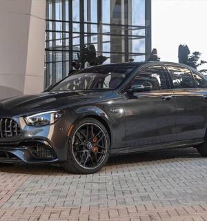a black car parked in front of a building