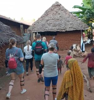 a group of people walking in front of a building