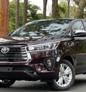 a black toyota fortuner parked on a road