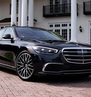 a black car parked in front of a building