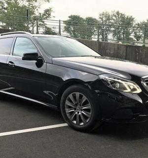 a black suv parked in a parking lot