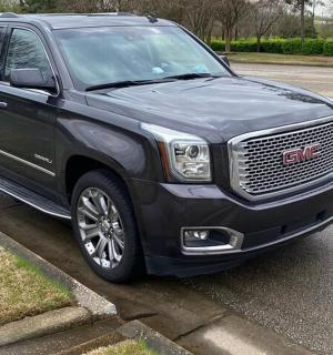a black truck parked in a parking lot