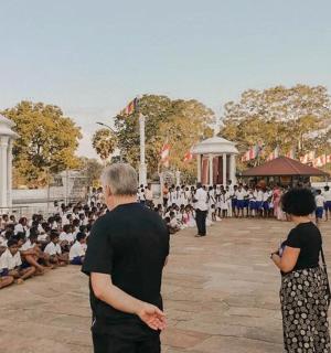 a group of people sitting in front of a crowd