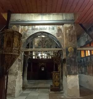 an entrance to a building with paintings on the walls