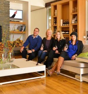 a group of people sitting on a couch in a living room