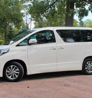 a white van is parked in a park