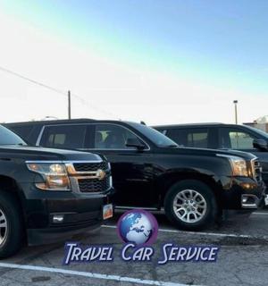 two black trucks parked in a parking lot