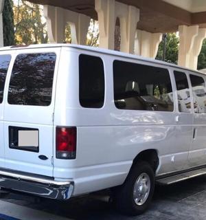 a white van parked in a parking lot