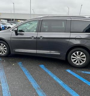 a silver van parked in a parking lot