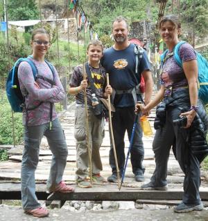 a group of people standing on a bridge