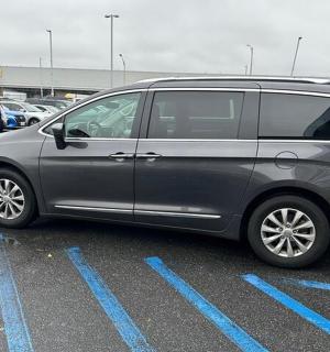 a silver van parked in a parking lot