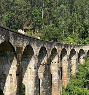 a stone bridge with many arches on it