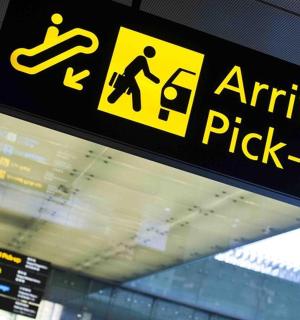 a sign for an airport pick up sign