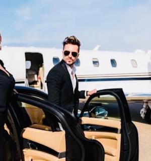 a man and a woman getting out of an airplane