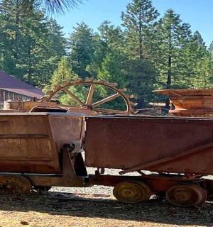 an old train car sitting on the tracks
