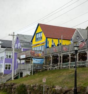 a group of houses on the side of a street