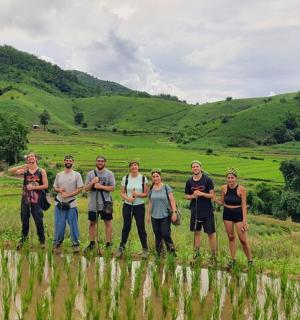 a group of people standing in a field