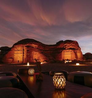 a table in front of a rock formation