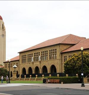 a large building with a clock tower on a campus