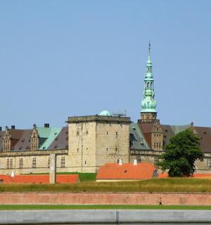 a large castle with two towers on top of it