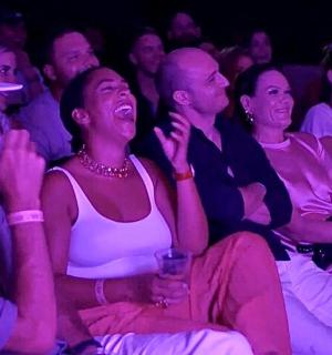 a group of people sitting in a crowd at an event