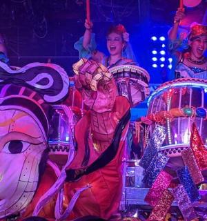 a group of people riding on a carousel