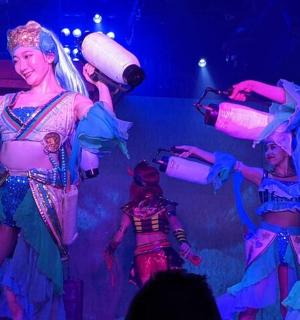 a group of performers on the stage at a performance