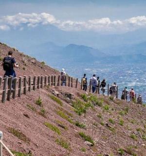 a group of people standing on top of a hill