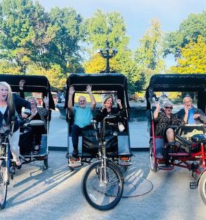 a group of people riding in a t pulled carriage