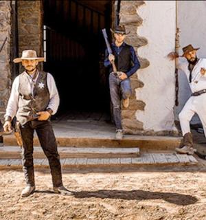 a group of men standing in front of a building
