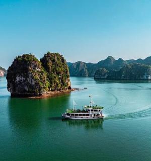 a boat in the water near a small island