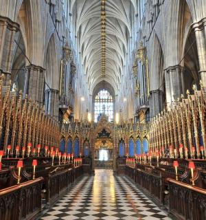 a large cathedral with rows of pews in it