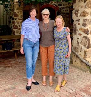 a group of three people posing for a picture