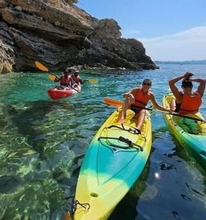 a group of people in kayaks in the water
