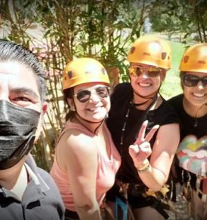 a group of people wearing hard hats posing for a picture