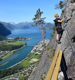 a man standing on a rock cliff