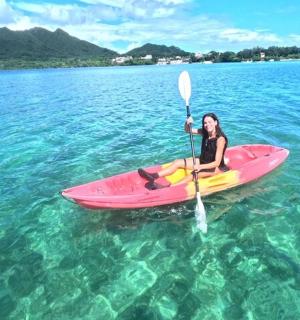 a woman is sitting on a kayak in the water