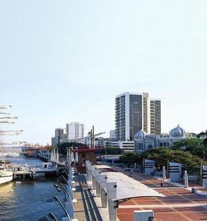 a harbor with a ship in the water and buildings