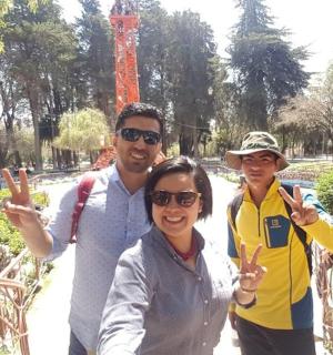 a family posing for a picture in a park