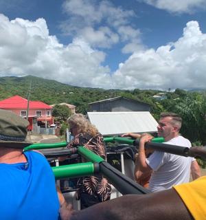 a group of people standing around a truck