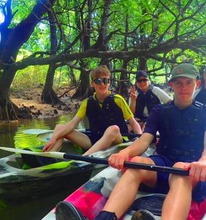 a group of people kayaking on a river